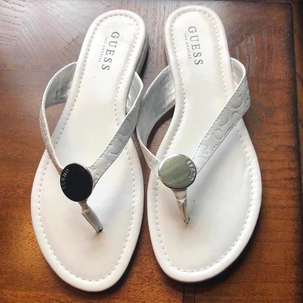 All white Guess Flip Flops